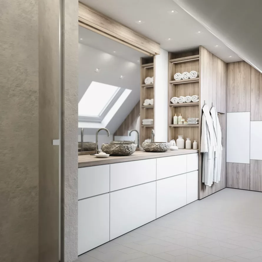 Salle de bain sous combles avec meuble vasque sur mesure, rangements décor bois, façades blanches et niches ouvertes.